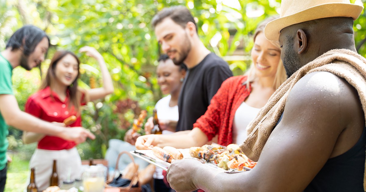 Group of people at an outdoor barbeque.
