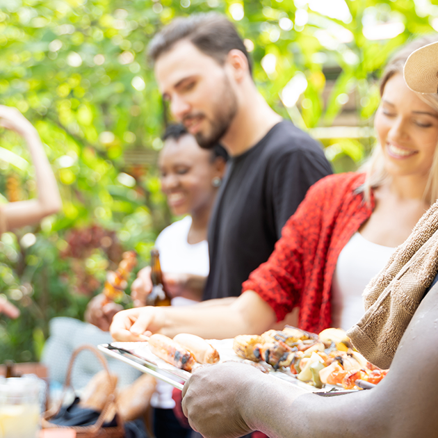 Group of people at an outdoor barbeque.