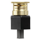 A close-up of a plumbing or irrigation valve component with a black square body, a brass top fitting, and a threaded lower section, shown against a solid background.
