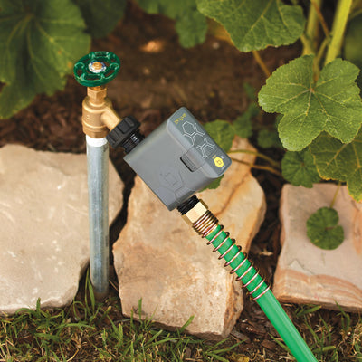 Gen 2 B-hyve smart hose watering timer. Attached to an outdoor water spigot with a hose connected to the timer outlet. 