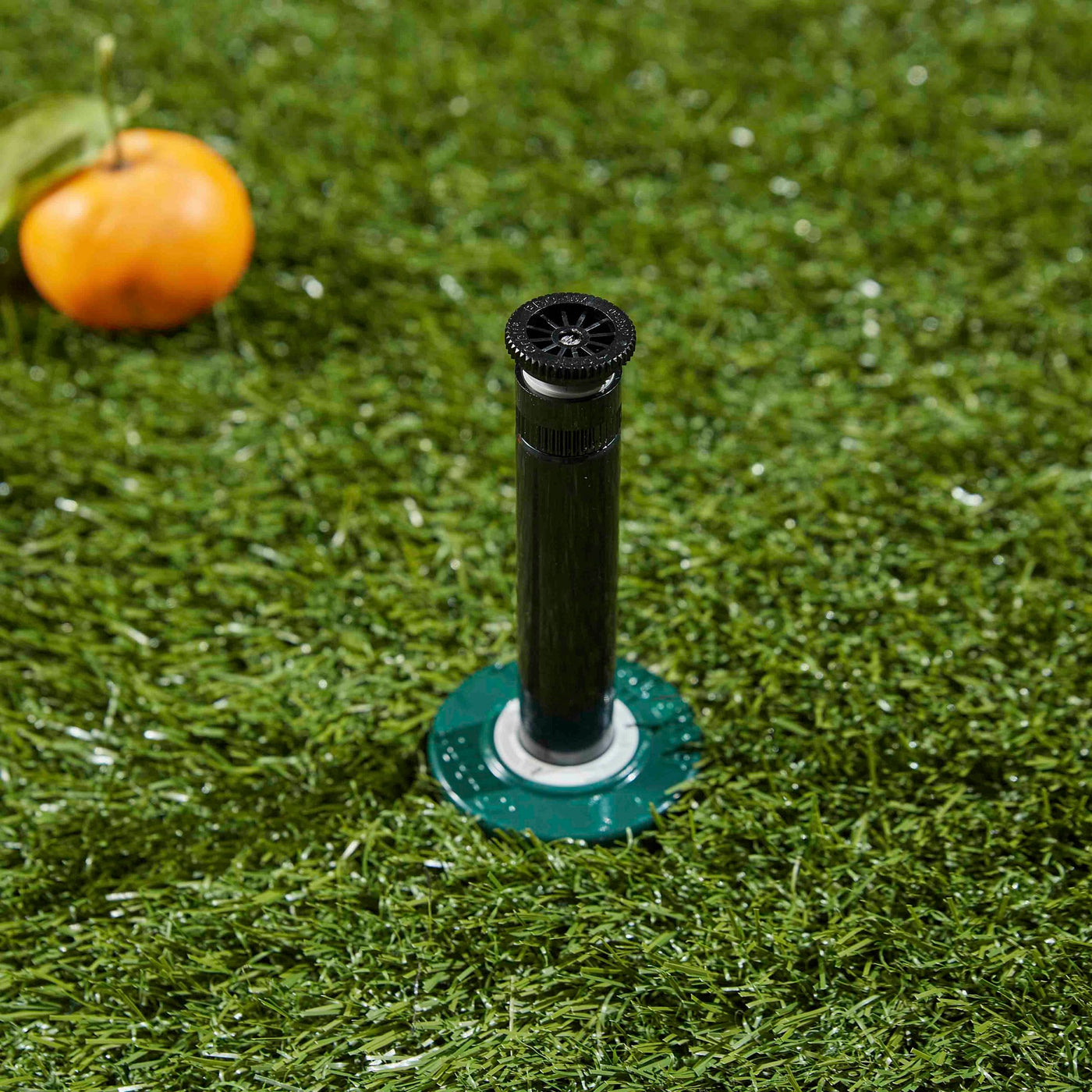 Extended riser stem on a professional hard top pop-up spray head sprinkler with adjustable nozzle. 
