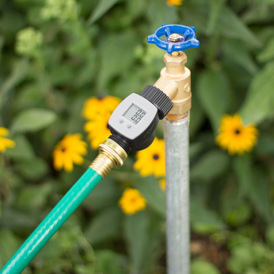 Hose end water flow meter. Model number 56854N. Attached to outdoor garden spigot. 