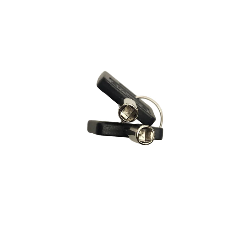 A pair of small black and silver metal earbud tips or ear hooks, shown on a plain off-white background.