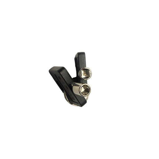 A pair of small black and silver metal hardware pieces, possibly bicycle headset components, placed on a plain white surface.