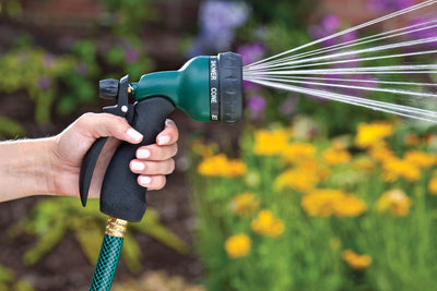 7-pattern metal rear trigger nozzle, emitting a spray of water.