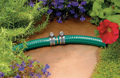 A garden hose that has been repaired with a 5/8 inch repair brass shank mender.
