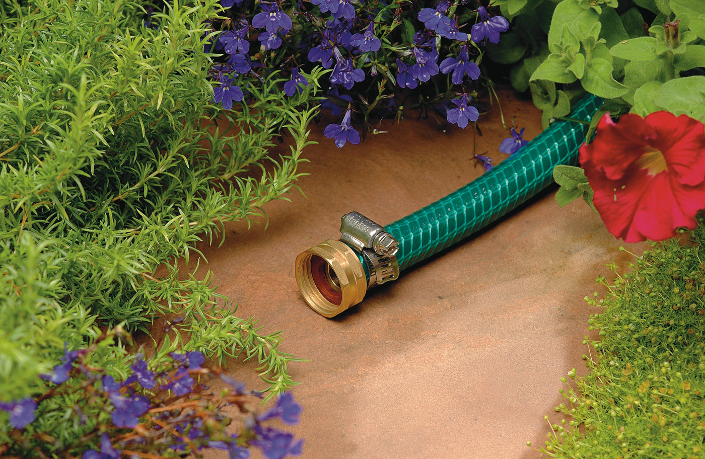 5/8 Inch Female Brass Shank Mender - Showing repaired hose in garden 